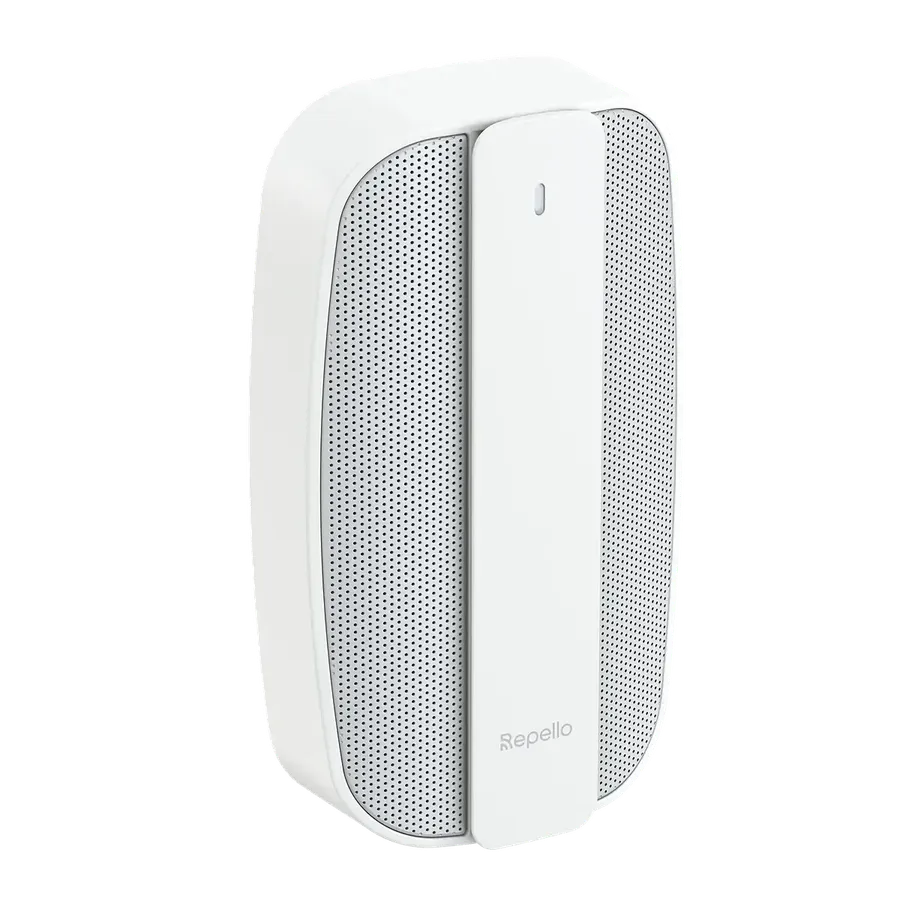 White Repello ultrasonic rat and mouse repeller seen at an angle: a rounded plug-in unit with two perforated speaker grilles on the front.